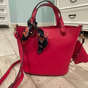 Nanette Lepore Pink Bucket Tote Handbag made of vegan leather.